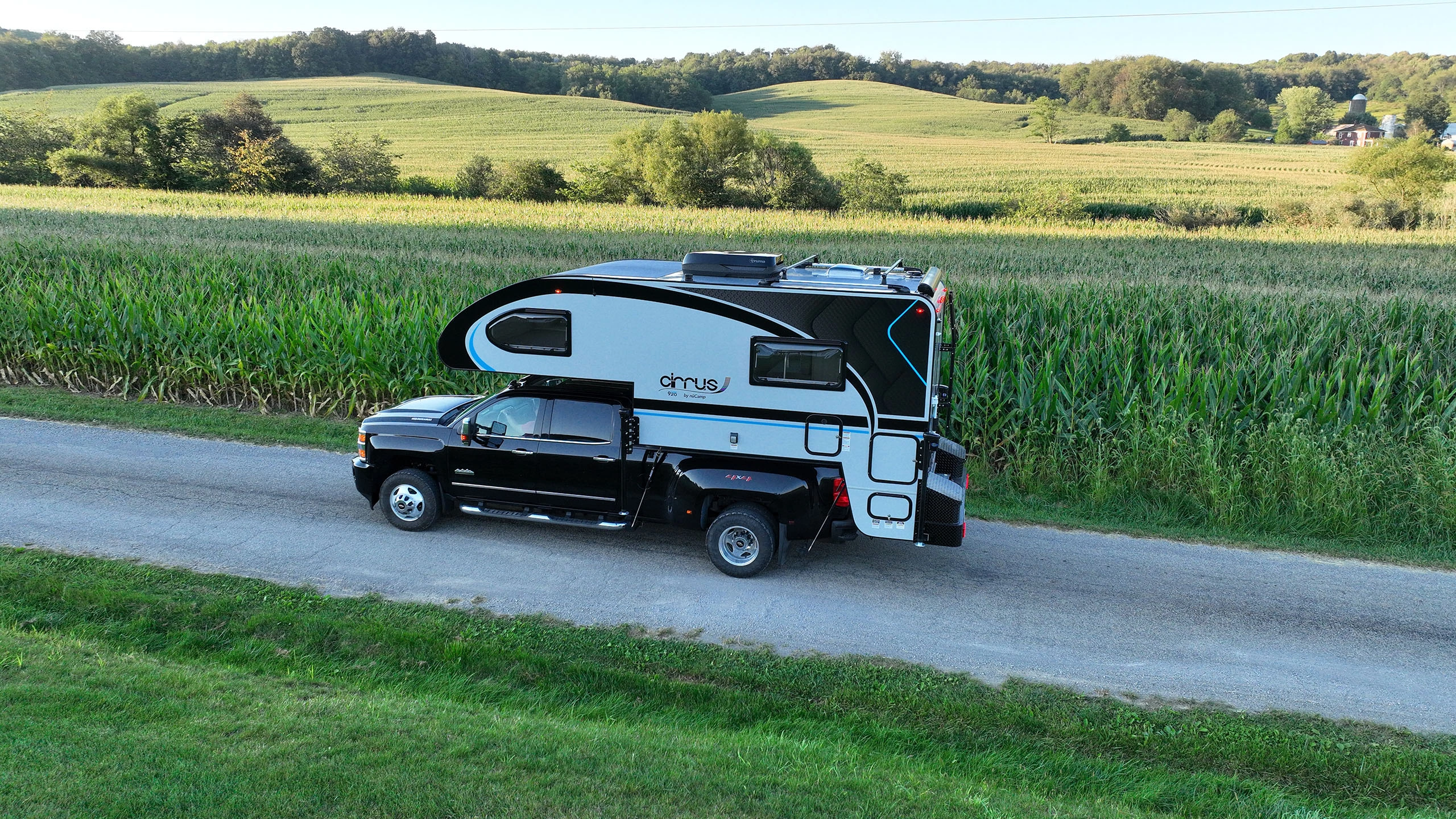 truck with cirrus 920 truck camper in front of corn field