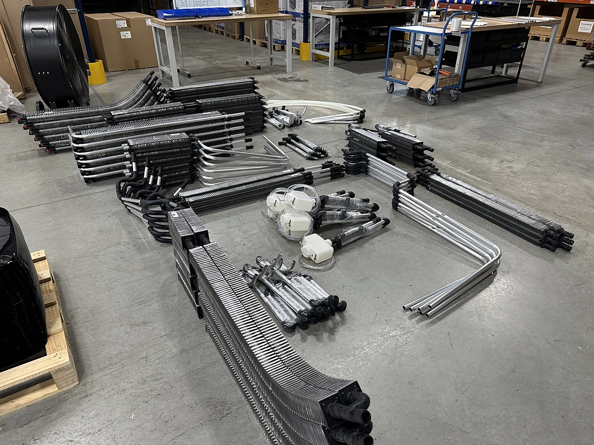 Alde convectors and components lined up for kitting