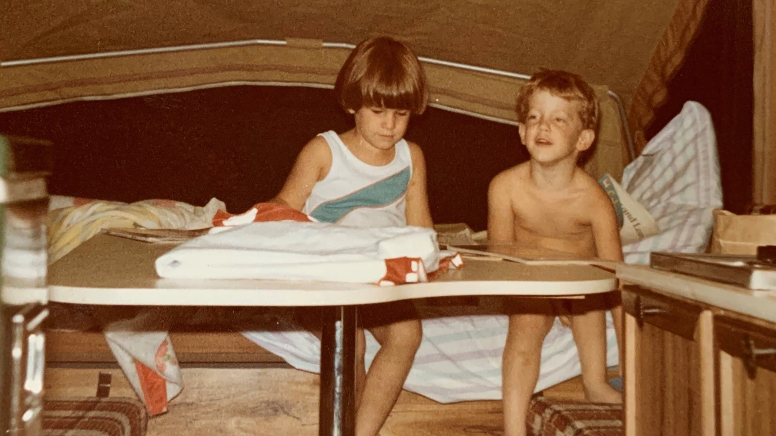 brothers in pop-up camper