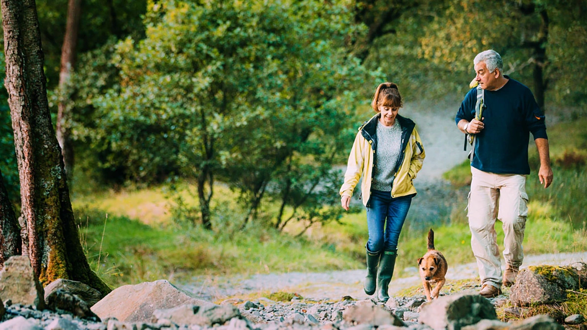 couple hiking with dog