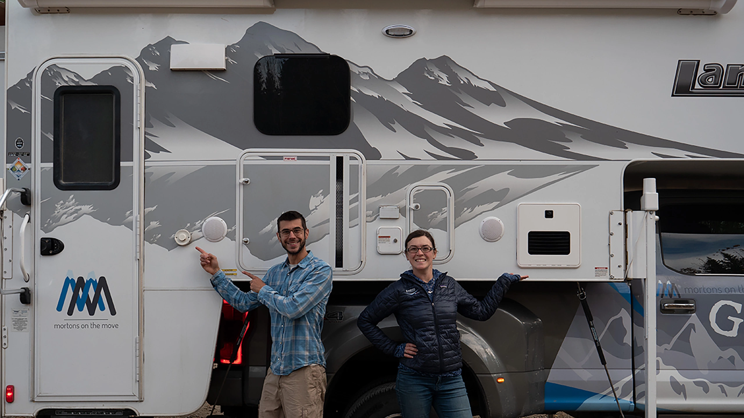 mortons on the move in front of truck camper
