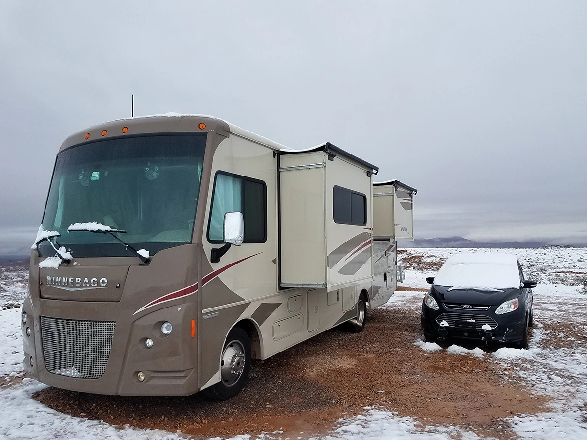motorhome with slides open in snowy weather
